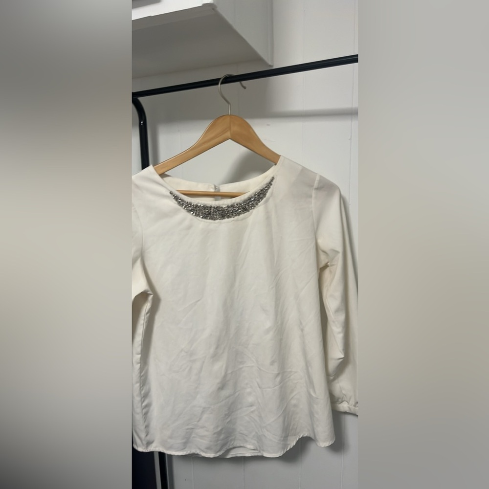 Elegant Cream Top with Silver Embellishments